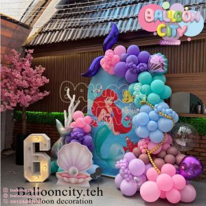 دکور تم تولد پری دریایی اریل با بکگراند طرح دار